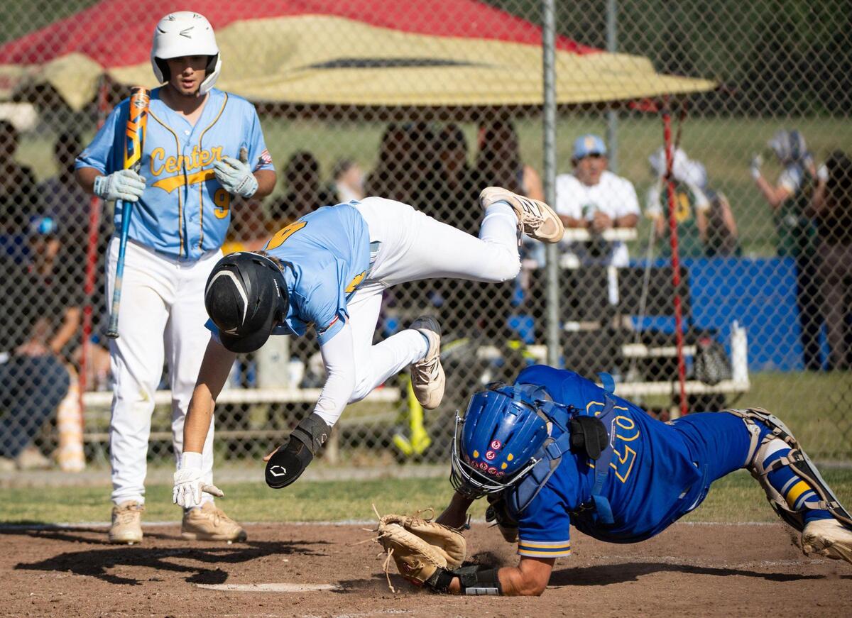 Center Cougars Andy Hintz is out at the plate as he crashes into Del Campo Cougars catcher AJ Paulsen in the fifth inning during a first-round Sac-Joaquin Section Division IV baseball playoff game on Wednesday in Fair Oaks.