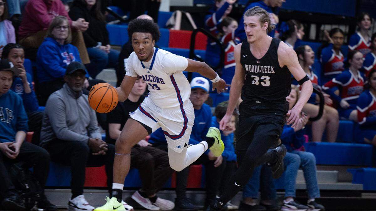 The Christian Brothers Falcons’ Stephan Hewitt (13) dribbles past the Woodcreek Timberwolves’ Max VanLaningham (33) last month. Both are among the front-runners for Sacramento Bee Player of the Year honors.
