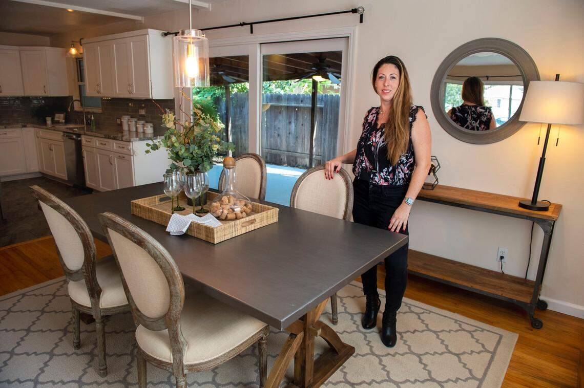 Leanna Halldorf, a real estate agent with Guide Real Estate, stands at a home in July in Sacramento’s Brentwood neighborhood that is listed at $425,000. She says its important for first-time home buyers to feel comfortable with their agent and choose someone who fits their style of communication.