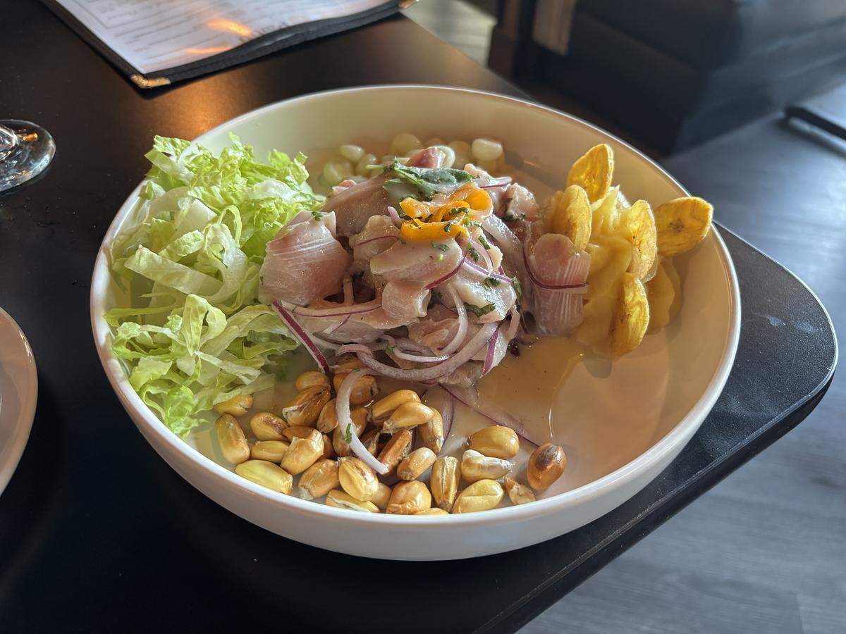 Paititi Peruvian Bistro’s ceviche clásico centers raw mahi-mahi with red onions and spicy, citrus-forward leche de tigre sauce. Accompanying the fish are Peruvian choclo and cancha corn varieties, sweet potatoes and lettuce.
