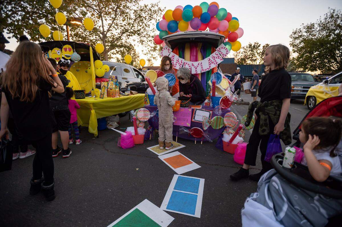A child “trunk or treats” at the back of a vehicle decorated as Candyland for Annette DelBiaggio’s kindergarten class at Florence Markofer Elementary on Oct. 15.