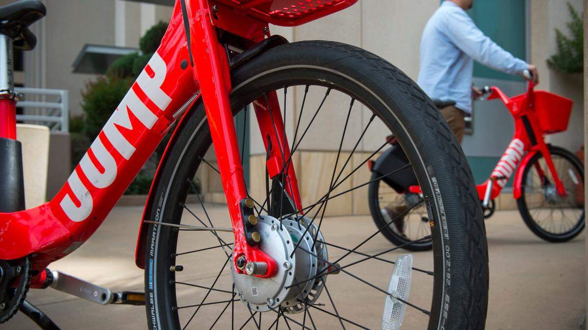 A.J. Tendick of SACOG shows off two of Sacramento’s new JUMP bikes, electric rideshare bikes that are set to hit the streets of Sacramento next week. Tendick said in Sacramento users must “lock the bike to a fixed object, such a bike rack or possibly a pole which limits the bikes being in the way of pedestrians. “