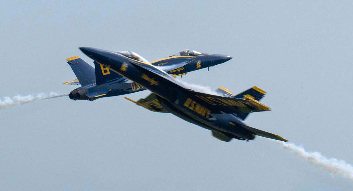 Two U.S. Navy Blue Angels F/A-18 Hornets fly past each other at the California Capital Airshow at Mather Airport on Saturday, March 22, 2025.