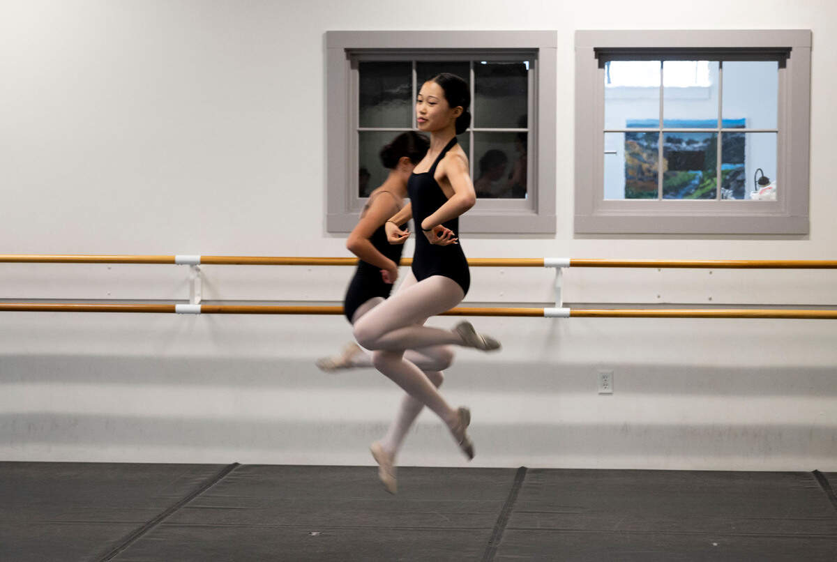 Nutcracker youth cast members Hannah Gong, 14, right, and Caitlyn Sauer, 13, rehearse the part of mushrooms dance at the Sacramento Ballet studios  in midtown earlier this month.