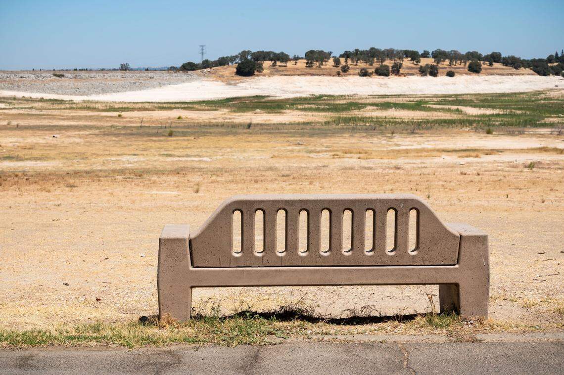 A concrete bench designed to offer views of Folsom Lake faces dry earth at Beal’s Point the reservoirs water storage hit a five-year low on July 10.