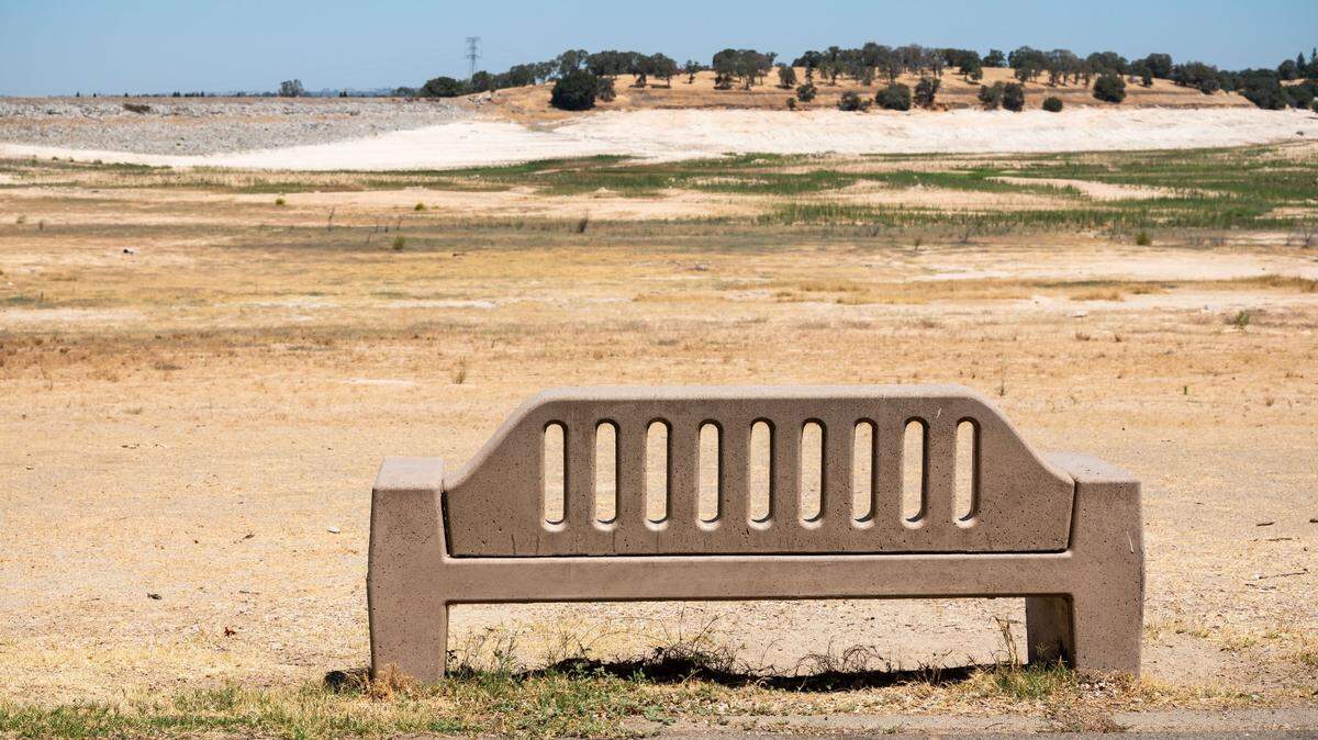A concrete bench designed to offer views of Folsom Lake faces dry earth at Beal’s Point. The reservoir’s water storage hit a five-year low on Saturday, July 10, 2021.