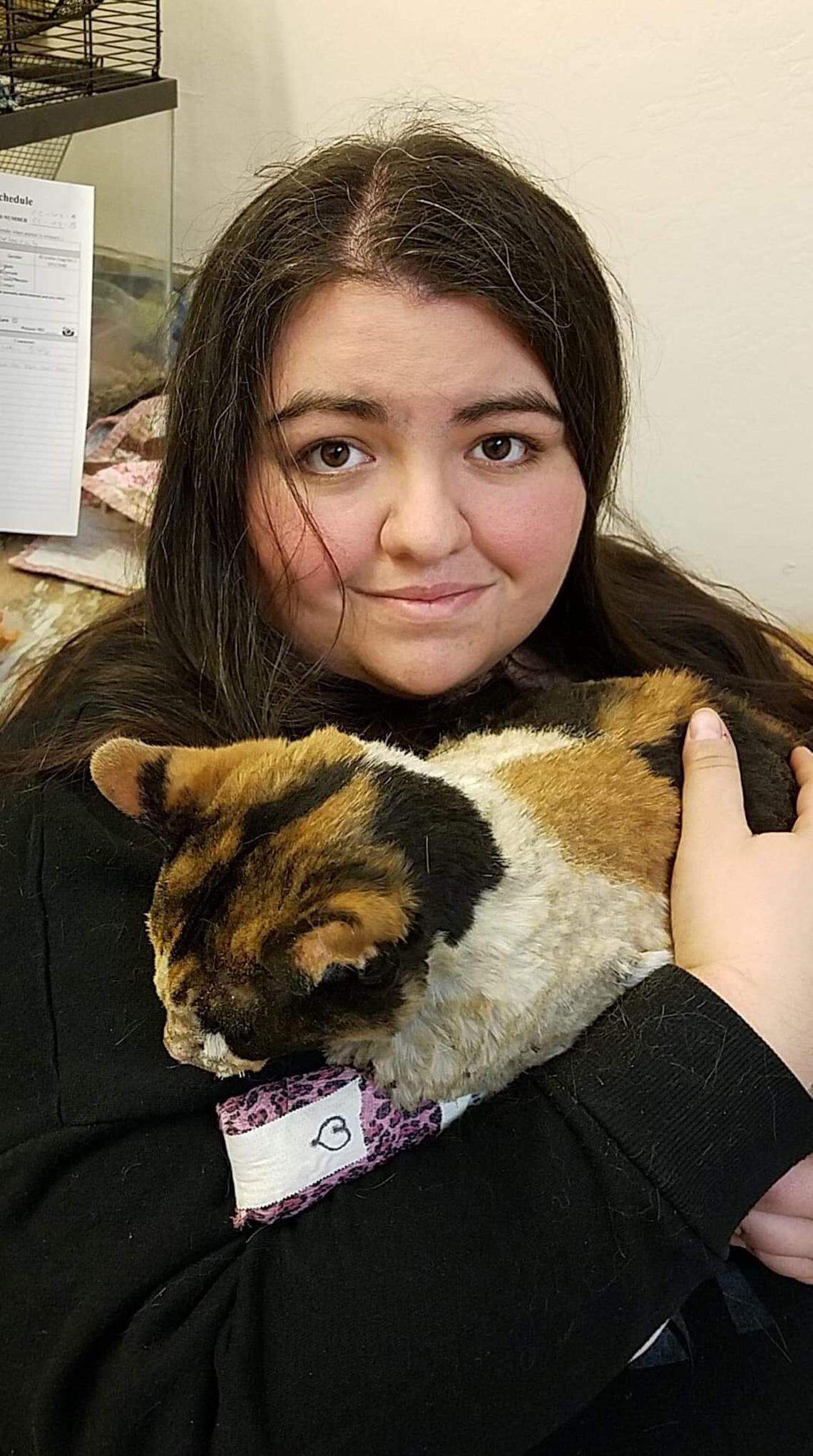 Lyn Martin holds her cat, London, after being reunited with the cat Sunday after Sacramento Bee reporter Ryan Sabalow found it while reporting on the Camp Fire in Paradise and brought it to Chico.