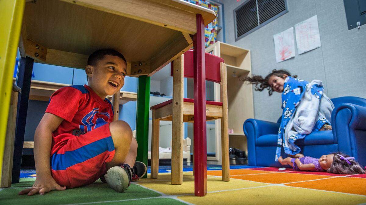 Joshua Montoya, 5, and Ava-Marie Gonzalez, 4, play during free time at Strauch Elementary Preschool in Sacramento on July 31.