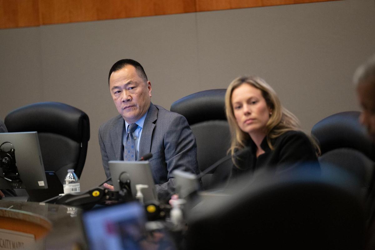 Sacramento City Councilmember Caity Maple and City Manager Howard Chan listen to Councilmember Eric Guerra urge his colleagues to reject Chan’s contract extension during a meeting on Tuesday, Dec. 17, 2024. The council voted 6-3 against extending the contract.