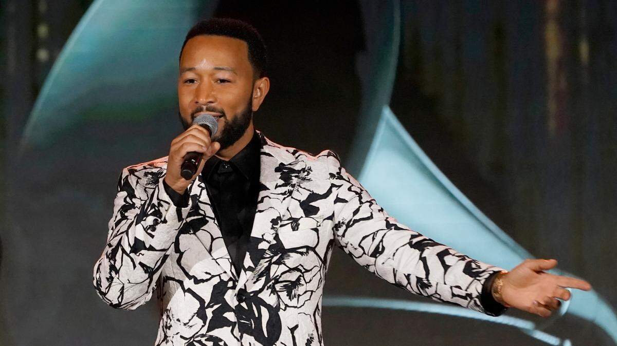 John Legend accepts the Global Impact Award at the Recording Academy Honors Presented By The Black Music Collective in April at Resorts World Las Vegas.
