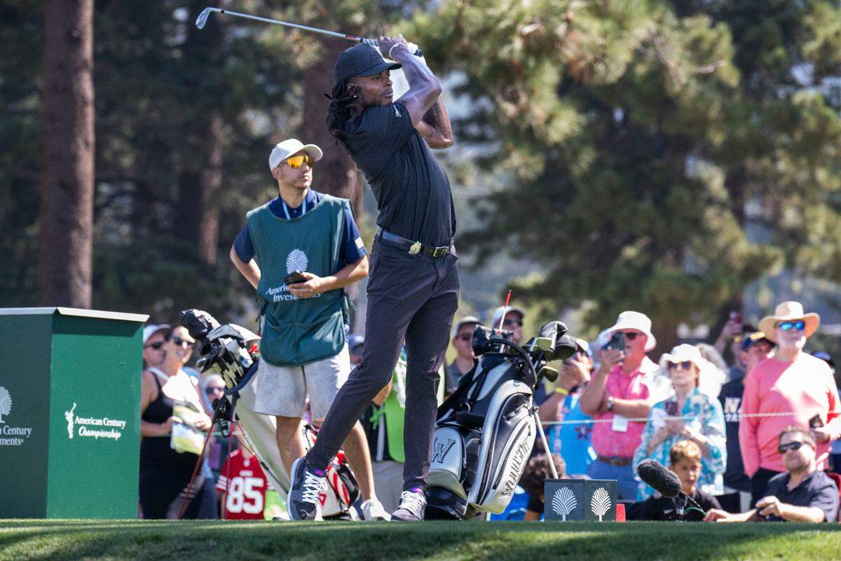Los Angeles Rams player Davante Adams follows through on a swing during the final day of the American Century Championship celebrity golf tournament at Edgewood Tahoe Resort in Stateline, Nev., on Sunday, July 13, 2025.