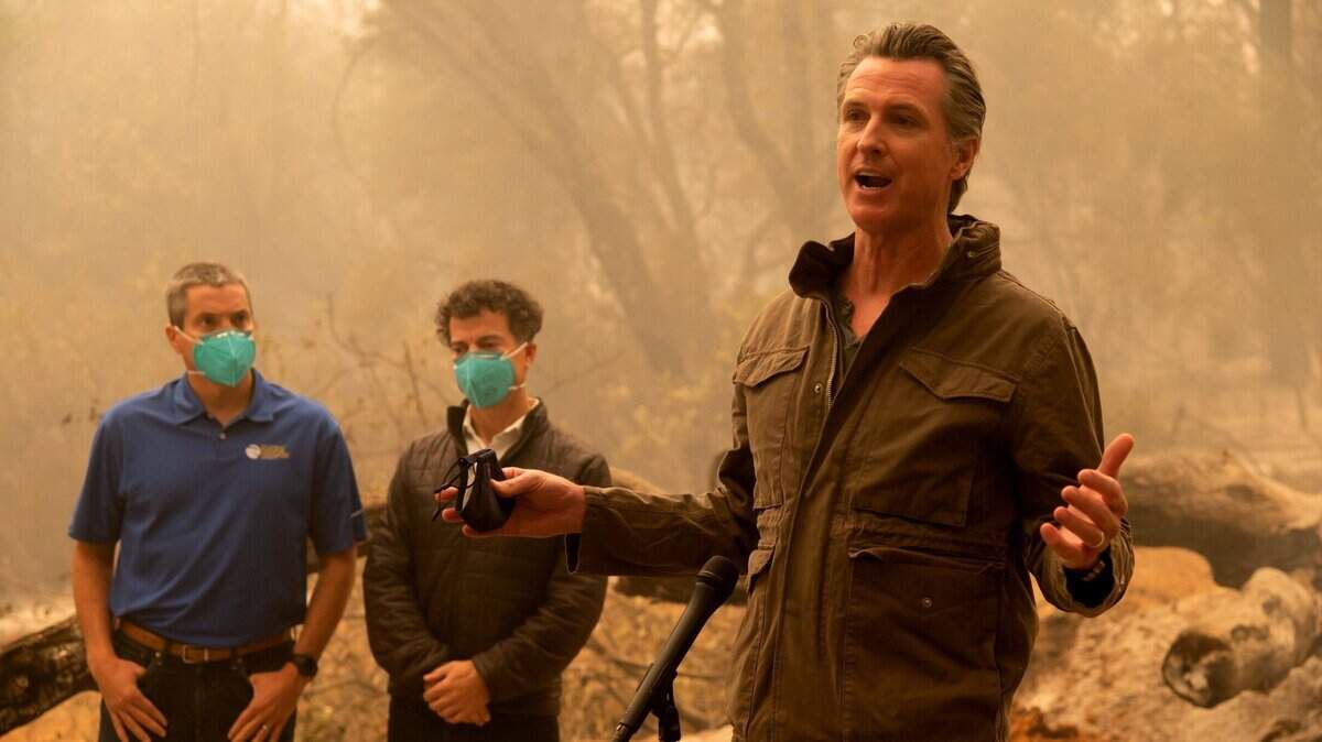 Gov. Gavin Newsom talk to the media after he toured the North Complex Fire zone with California Secretary for Natural Resources Wade Crowfoot and California Secretary for Environmental Protection Jared Blumenfeld in Butte County on Friday, Sep 11, 2020, outside of Oroville.