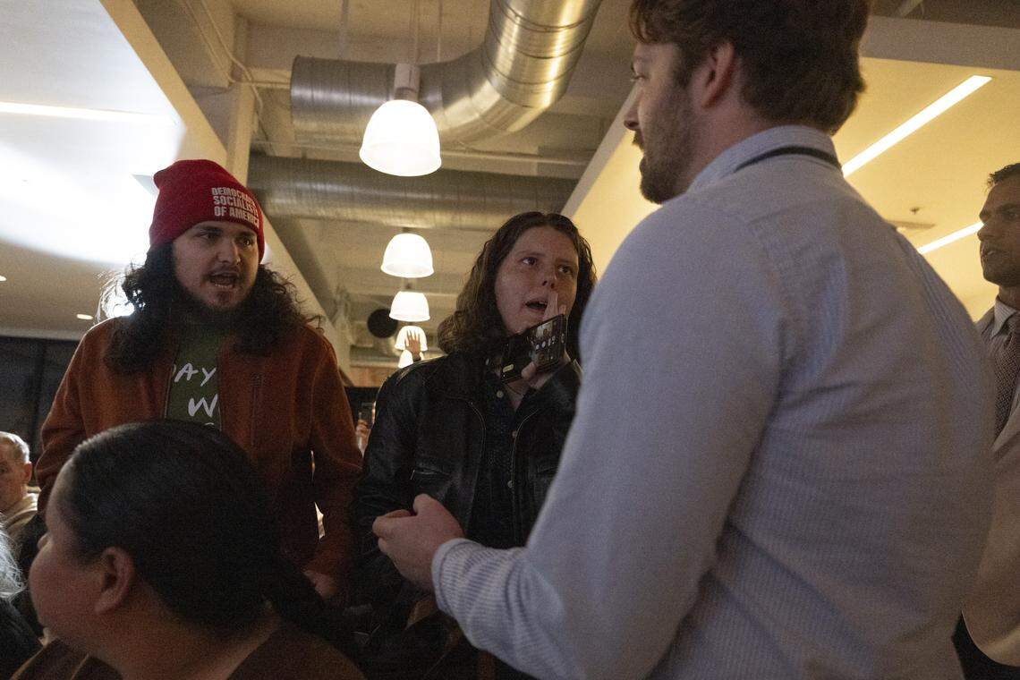 Pro-Palestinian protesters are removed from a campaign event for Democrat Tom Steyer, a billionaire running for governor, in Sacramento on Thursday. The protesters repeatedly yelled for Steyer to acknowledge the Gaza war as a genocide.