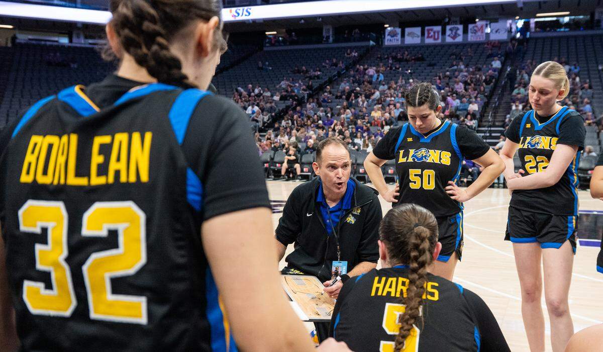 Faith Christian Lions coach Geoff Harris diagrams a play during a timeout against the Bret Harte Bullfrogs in the CIF Sac-Joaquin Section Division V girls basketball championship at Golden 1 Center on Feb. 28. Harris stepped down after the 2025-26 season.