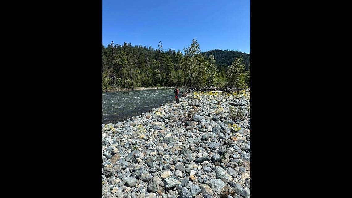 The 57-year-old was stranded in Trinity River, rescuers said.