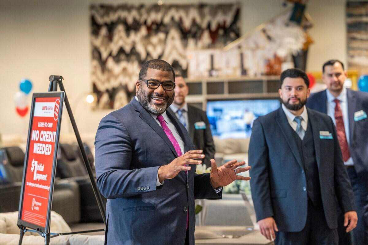 Kevin Parker, zone vice president for Bobs Discount Furniture, welcomes staff and visitors to the new store in Folsom on Friday, May 27, 2022.