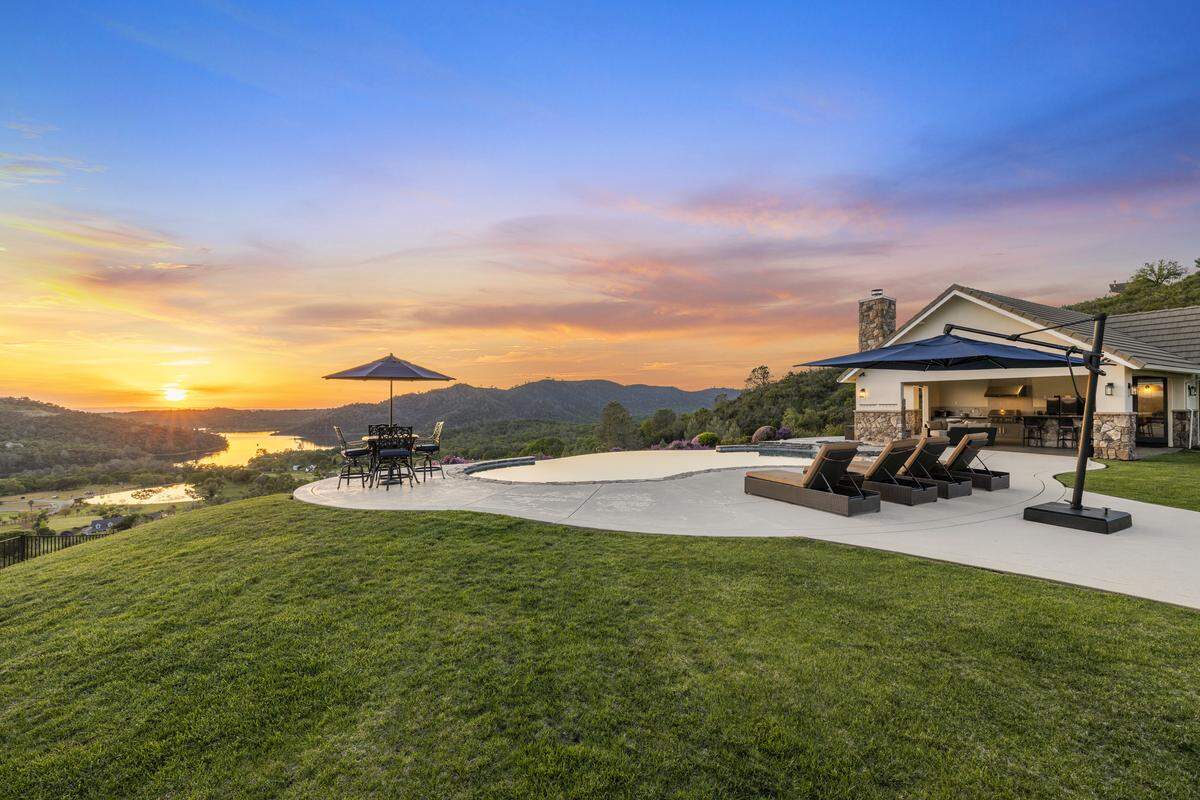 The remodeled El Dorado Hills residence spans 4,179 square feet with five bedrooms and 4.5 bathrooms, set on an 8.16-acre parcel designed to maximize lake and valley views.
