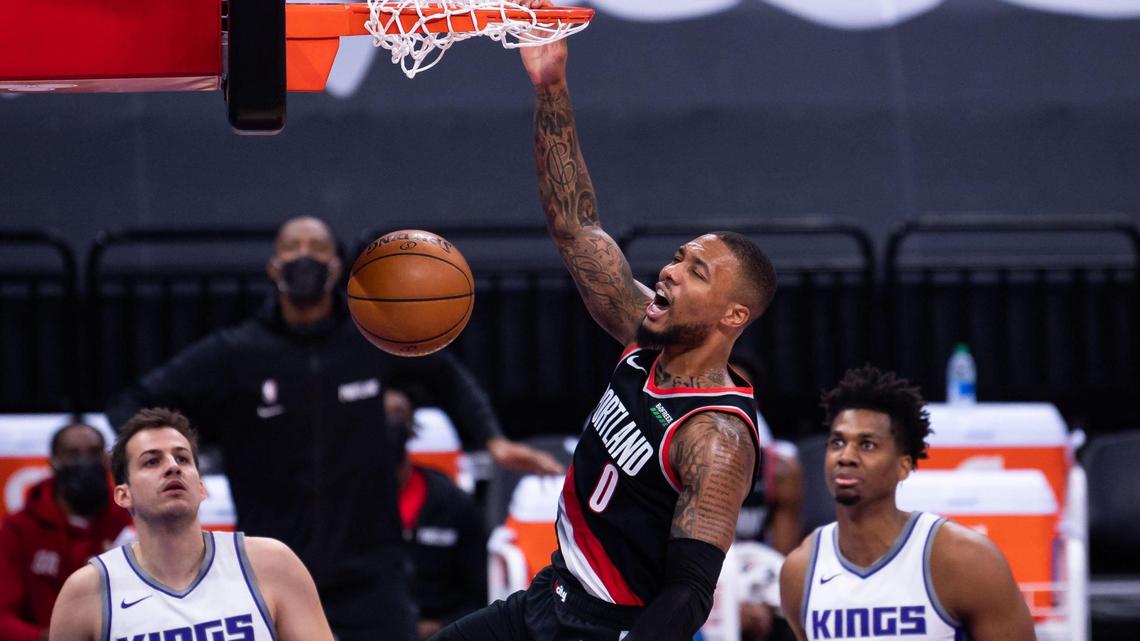 Portland Trail Blazers guard Damian Lillard (0) dunks against the Sacramento Kings during the first half of the NBA game Saturday, Jan. 9, 2021, at Golden 1 Center in Sacramento.