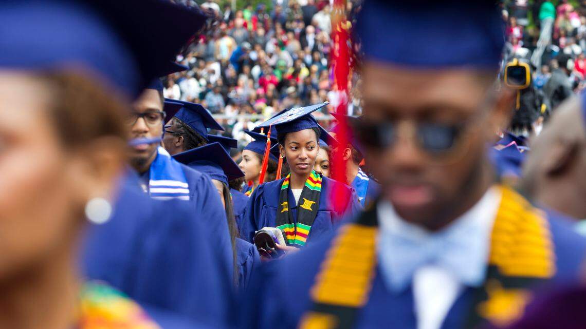 Graduate student walks to their place as their arrive to the 2016 Howard University graduation ceremony in Washington, Saturday, May 7, 2016. ( AP Photo/Jose Luis Magana)