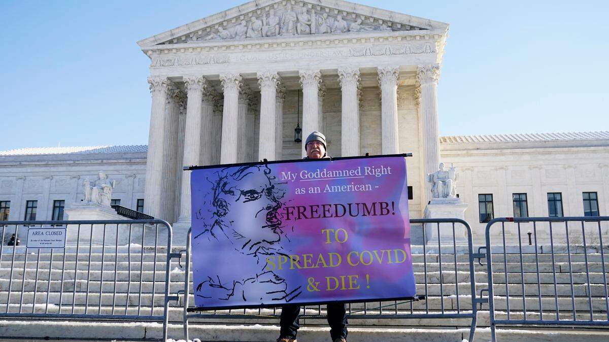 A protester stands outside the Supreme Court this month.