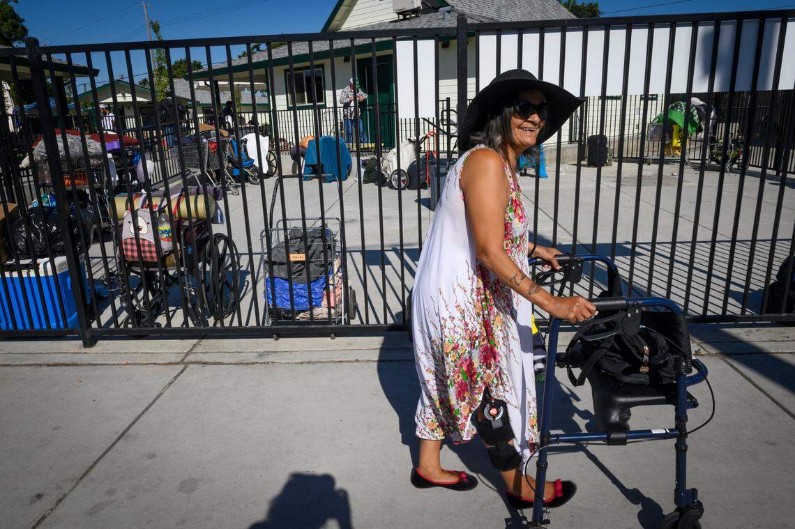 Gloria Pizaña walks near Friendship Park, a local hangout for homeless people, on Thursday, August 1, 2019, in Sacramento. Pizaña lives in Sister Nora’s Place, a long-term homeless shelter for women with a history of trauma, serious mental and physical illness.