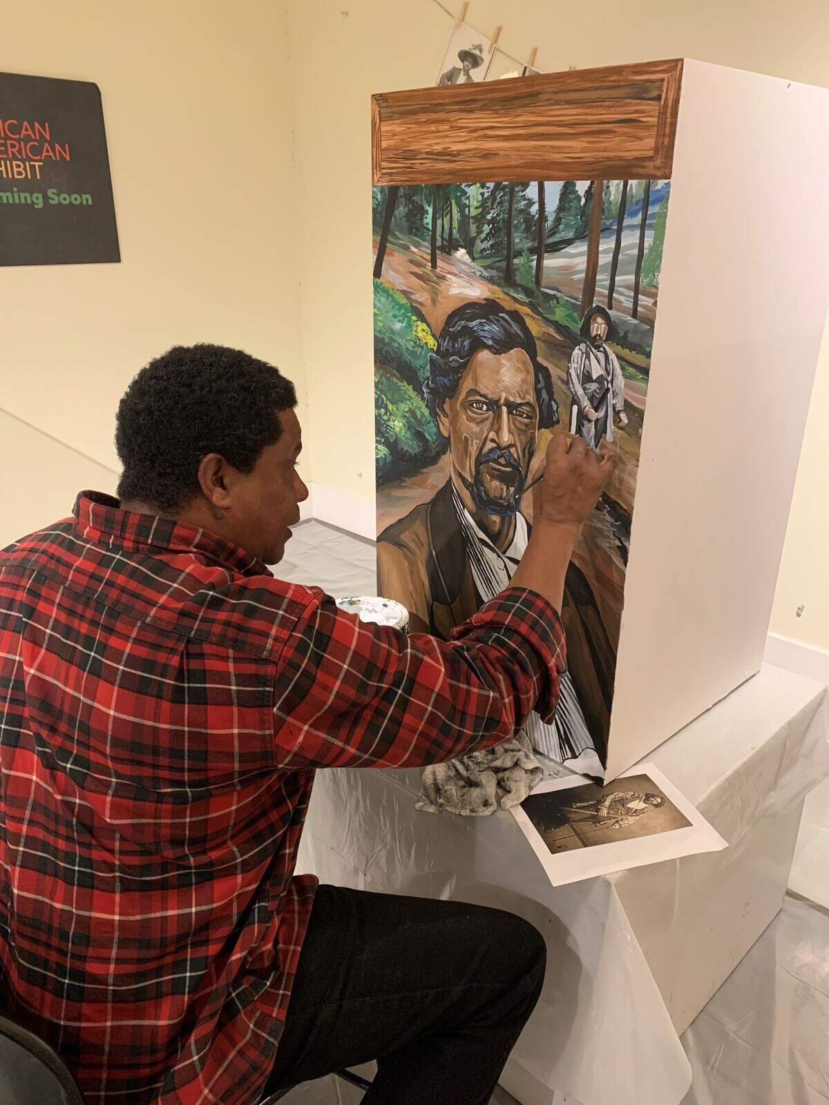 Artist and muralist Louie Lethridge paints during the installation of the exhibit From Barbers’ Row to Beale Air Force Base: Black History in Yuba-Sutter at the Sutter County Museum in Yuba City. Lethridge created original artwork for the exhibit, which received an Award of Excellence from the American Association for State and Local History.