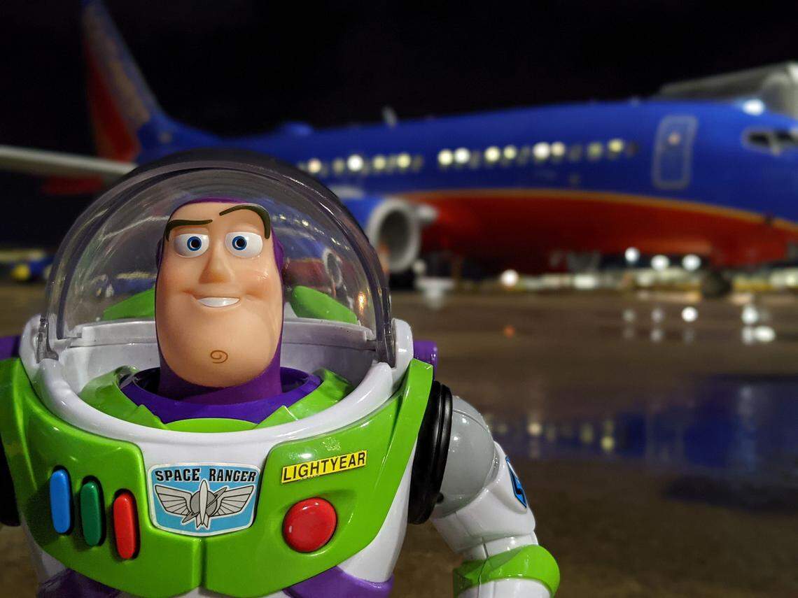 Buzz posed outside the Southwest plane.