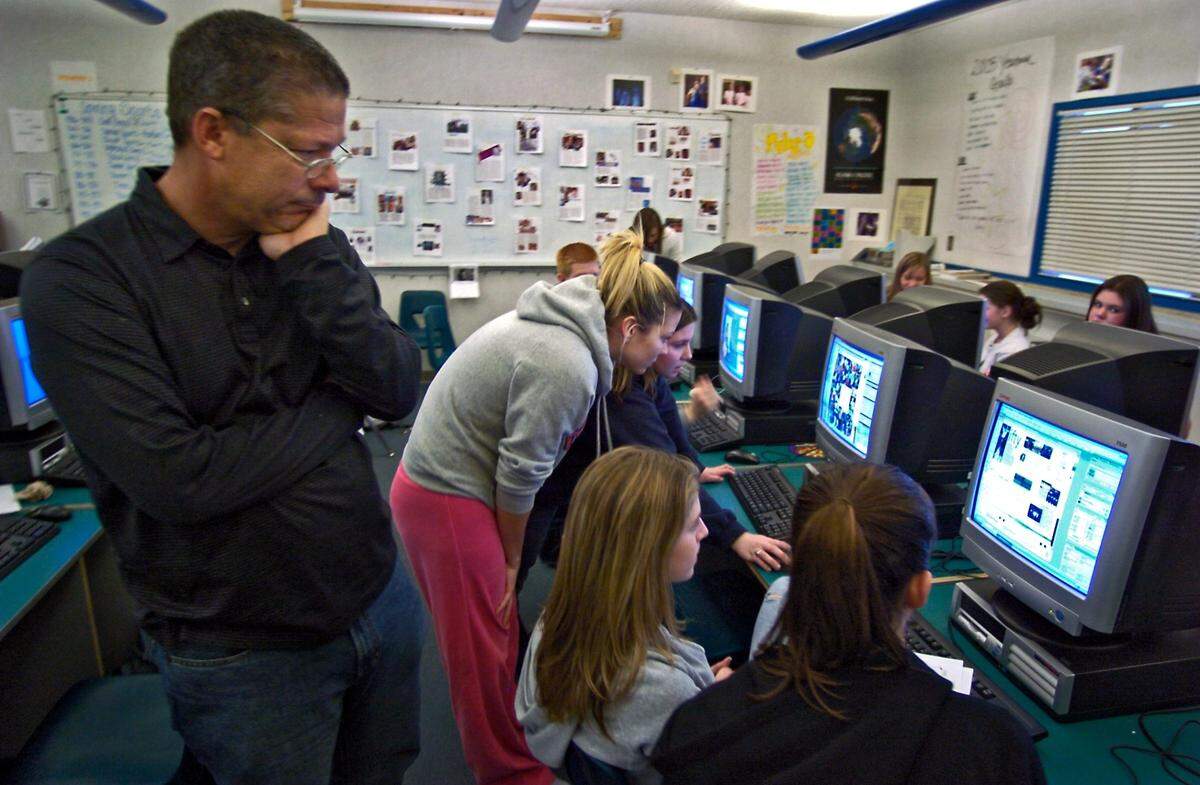Rocklin High School yearbook advisor Casey Nichols looks over yearbook staffers as they create layouts at the high school in 2005, after he was named National Yearbook Advisor of the Year by the Journalism Education Association.