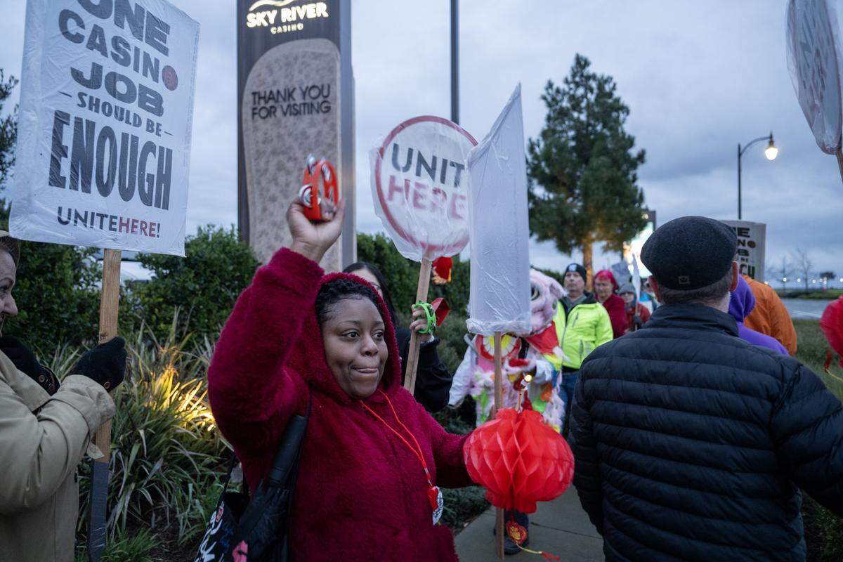 Supporter, Shamika O’Faire pickets with Sky River employees and supporters outside the casino for better wages and benefits on Tuesday in Elk Grove.