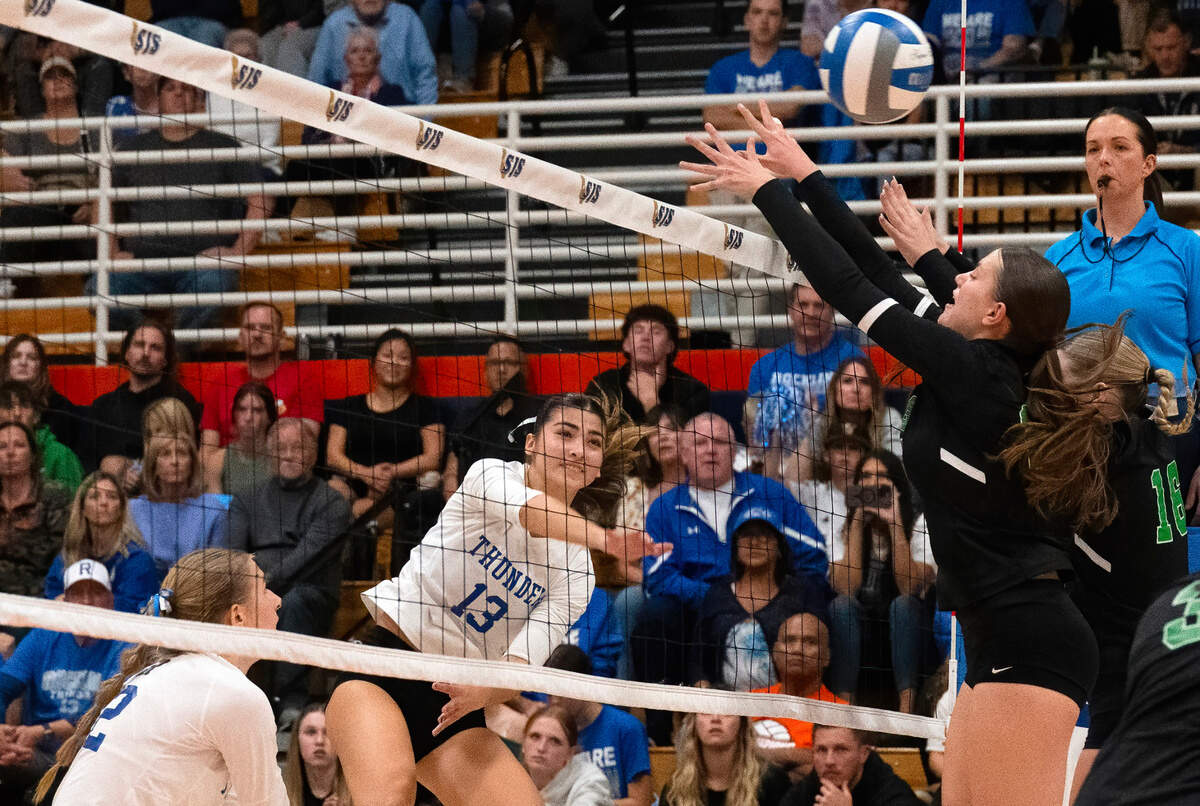 The Rocklin Thunder’s Gianna Bogan spikes against as St. Mary’s Rams defenders Alyssa Woody (16) and Mary Ustach (25) block in the Sac-Joaquin Section Division I volleyball championship final on Saturday, Nov. 9, 2024, at Cosumnes River College.
