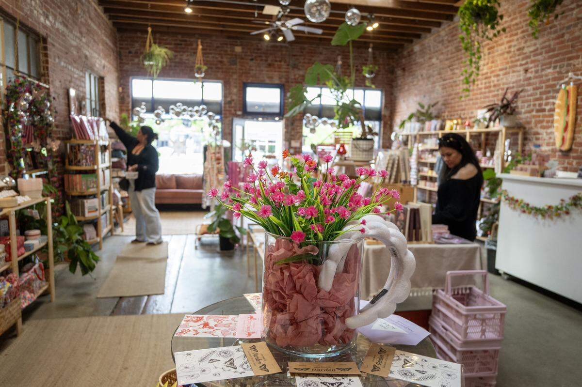 Customers shop at Golden Hour Designs in Oak Park on Tuesday, March 31, 2026.