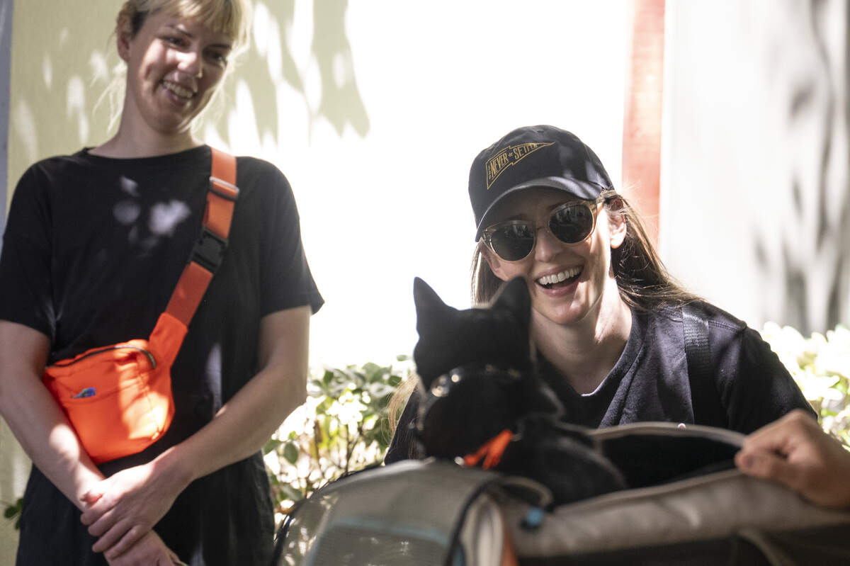 Haley Anthonisen reacts to meeting Smino the cat during the NorCal Resist Cat Tour in Sacramento on Sunday, June 7, 2026.