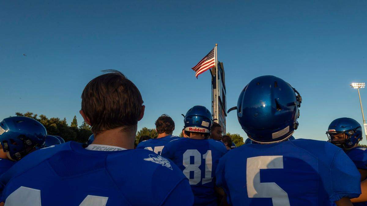 Davis High School Blue Devils listen to their coach before a 2019 game against the Grant Pacers. Davis forfeited this coming Friday’s game vs. the Folsom Bulldogs.