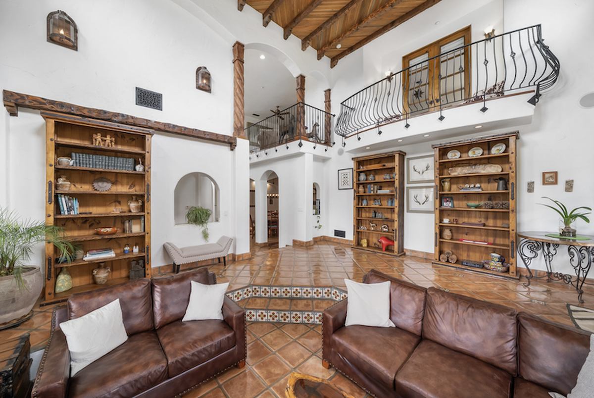 The interior dazzles with imported tiles, soaring ceilings and mezzanine balconies.