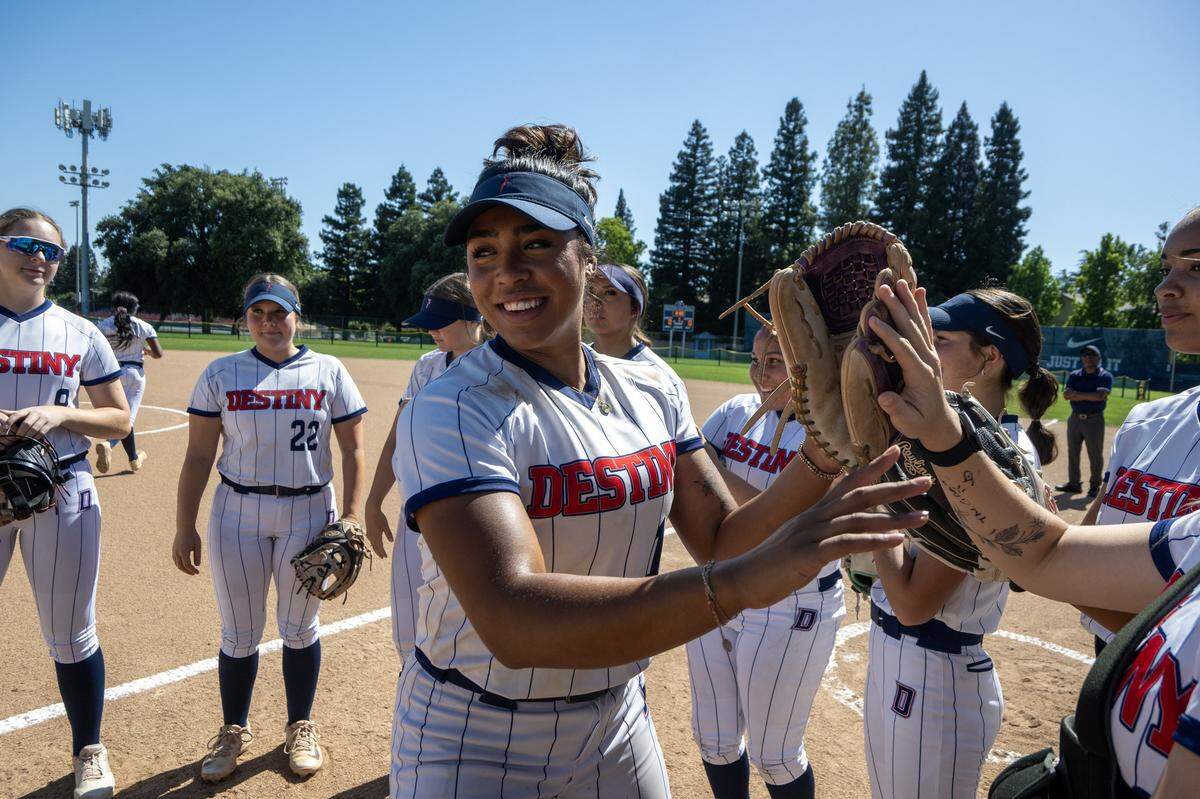 The Destiny Christian Lions' Ayla Tuua (19) takes the field in a softball game against the El Camino Eagles at Destiny Christian  in Rancho Cordova on April 29. 