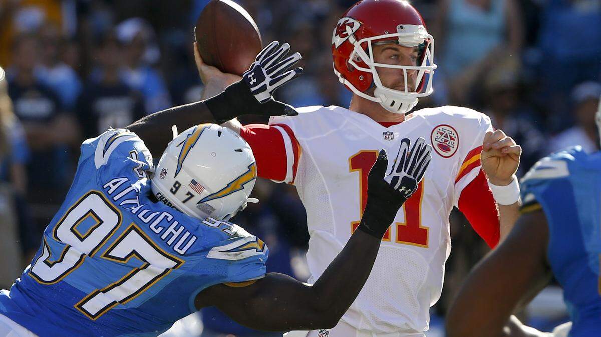 Kansas City Chiefs quarterback Alex Smith (11) throws a pass as San Diego Chargers linebacker Jeremiah Attaochu (97) defends during the first half of an NFL football game Sunday, Nov. 22, 2015, in San Diego.