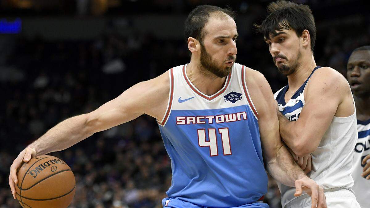 Kings center Kosta Koufos dribbles against Minnesota Timberwolves forward Dario Saric on Monday in Minneapolis. The Kings lost 132-105.