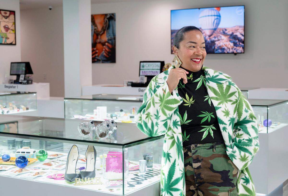 Crystal Nugs owner Maisha Bahati stands in her dispensary in midtown Sacramento in 2023. 