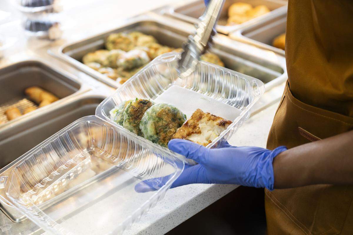 Food is placed on a tray during a soft opening of Tai Pan restaurant in Sacramento on Tuesday, Sept. 9, 2025.