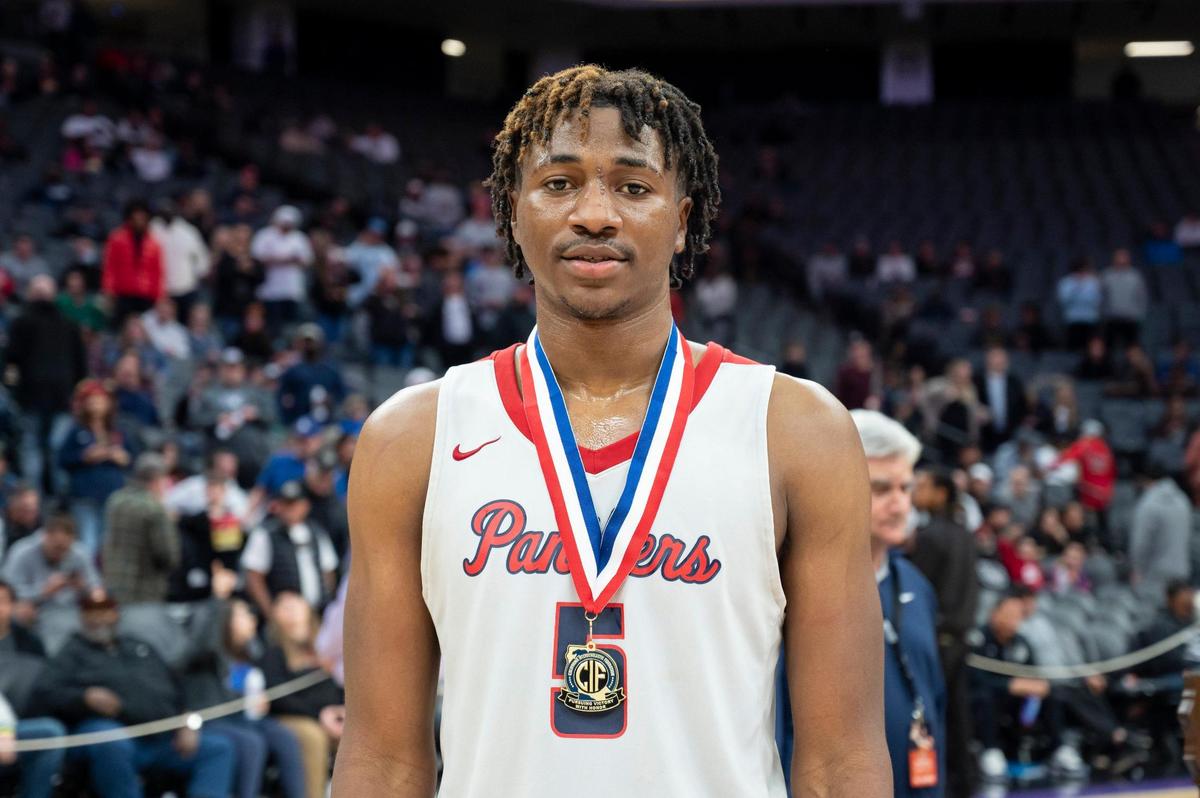San Joaquin Memorial Panthers forward Mike Davis Jr. (5) poses with his sportsmanship medal after winning the CIF State Division II Boys Basketball Championship against the Pacifica Christian Tritons on Saturday, March 11, 2023, at Golden 1 Center in Sacramento. Davis Jr. had a double-double with 17 points and 14 rebounds. The Panthers defeated the Tritons 58-47.