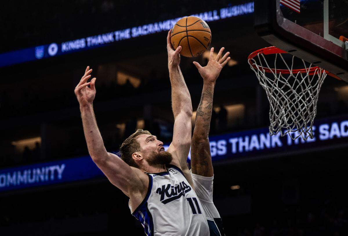 Sacramento Kings center Domantas Sabonis (11) dunks against the Dallas Mavericks during an NBA game on Monday, Dec. 30, 2024 at Golden 1 Center .