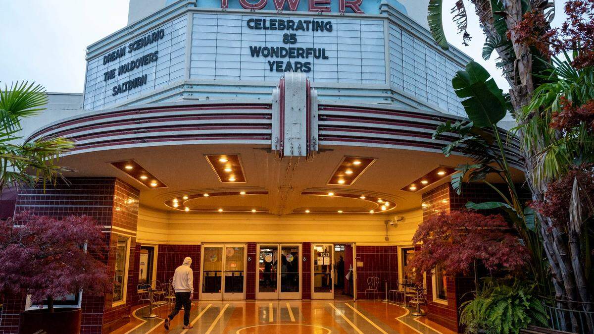The Tower Theatre marquee celebrates its 85th anniversary on Saturday. Film historian Matias Bombal gave a brief overview of the history of the theater before a screening of the 1988 coming-of-age drama “Cinema Paradiso.” The theater opened on Nov. 11, 1938.