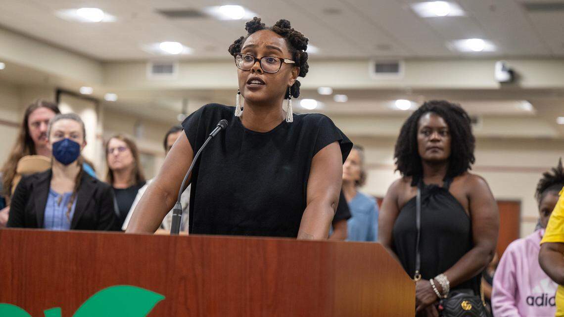 Erinn Leone, a teacher at Luther Burbank High School, addresses the Sacramento City Unified school board in August.