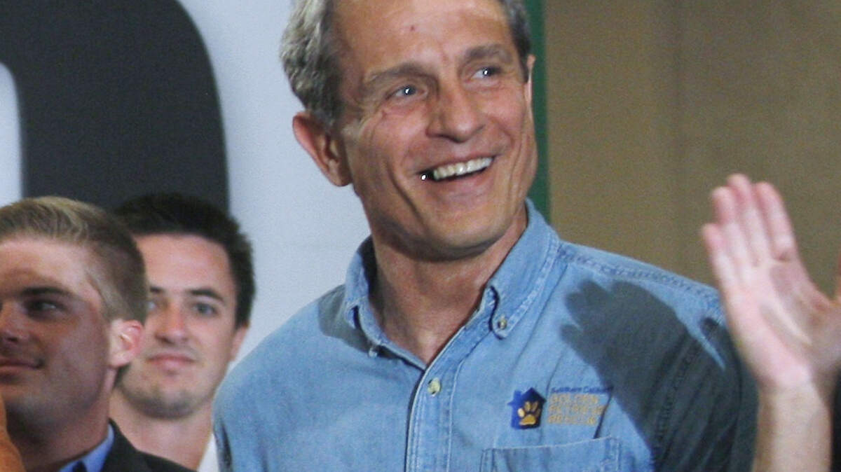 FILE - In this Sept. 22, 2010 file photo Ed Buck makes a campaign appearance for Meg Whitman, not shown, then a Republican candidate for governor of California, in Los Angeles. The prominent California Democratic donor, Buck, has been charged Tuesday, Sept. 17, 2019, with running a drug house where two men died of overdoses. Prosecutors allege Buck provided the meth that killed two men who were found in his apartment in 2017 and this January. (AP Photo/Damian Dovarganes, File)