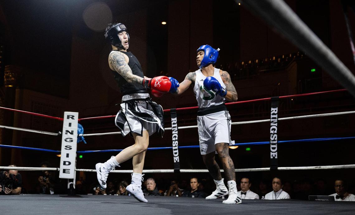 Kevin Shim of the Las Vegas Running Rebels reacts to a punch from Sacramento State’s Neal Fumar during the Causeway Boxing Classic at Memorial Auditorium on Friday.