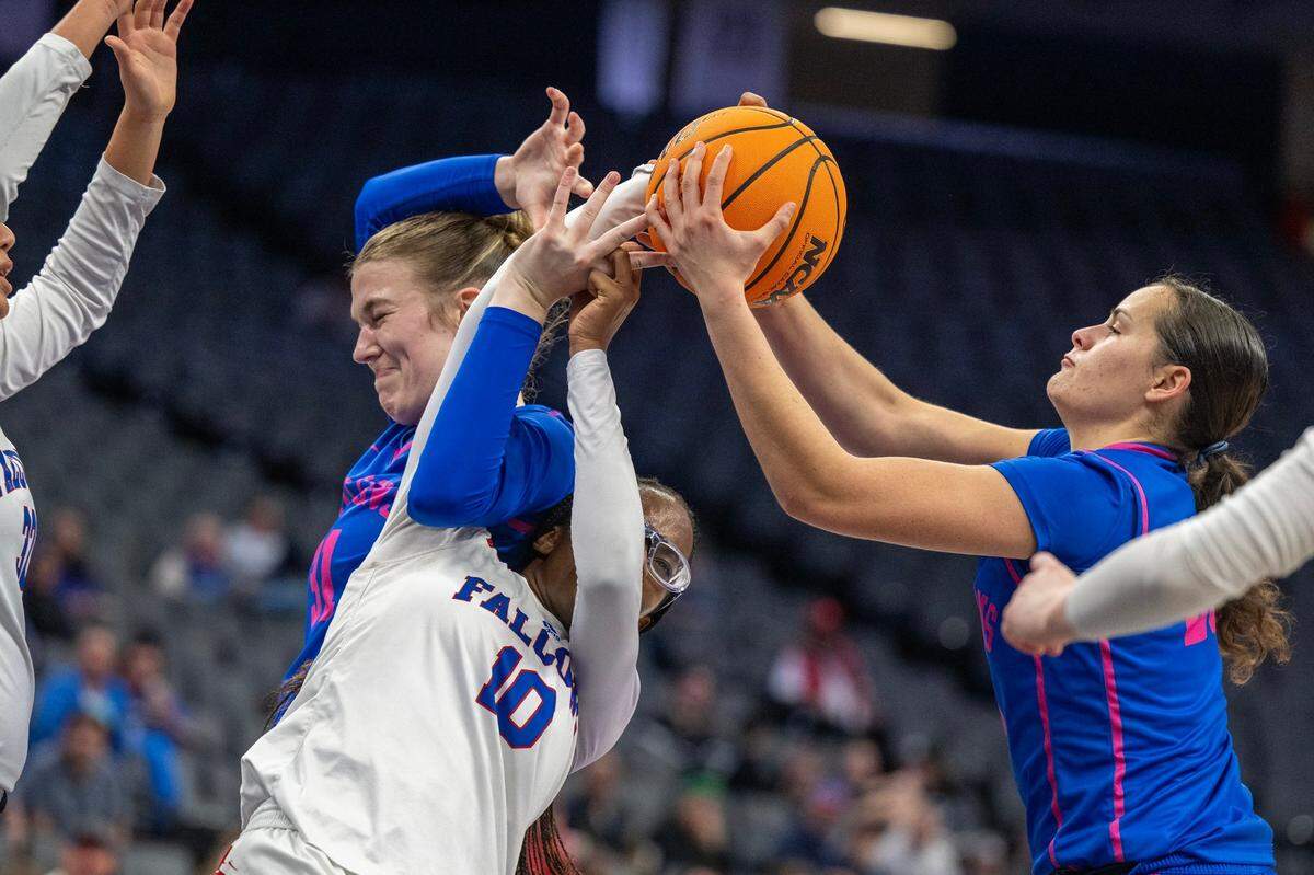The Atwater Falcons’ Cami Gibson (31) and Karissa Hukill (25) battle with the Christian Brothers Falcons’ Joy Omishakin (10) for a rebound in the first half of the CIF Sac-Joaquin Section Division ll girls basketball championship game at Golden 1 Center on Thursday, Feb. 27, 2025.