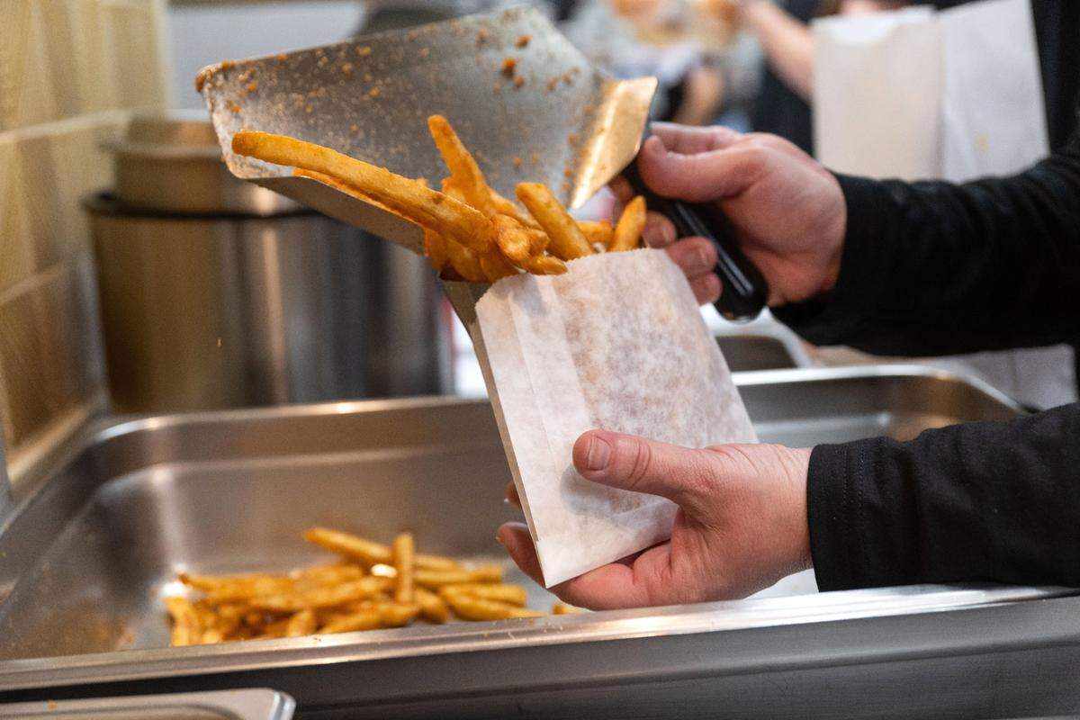 Fries are prepared to order at Lucky’s Drive-In restaurant on Thursday, March 6, 2025.