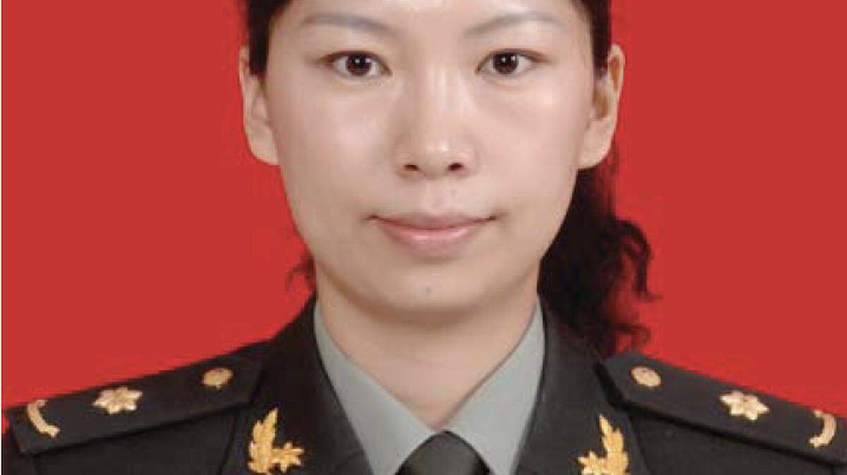 A photo from a criminal complaint filed in U.S. District Court shows Tang Juan in a military uniform.