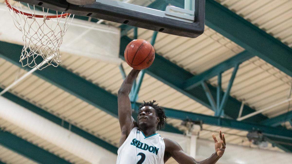 Xavion Brown of Sheldon rises for a thunderous dunk in a game against Jesuit this season.