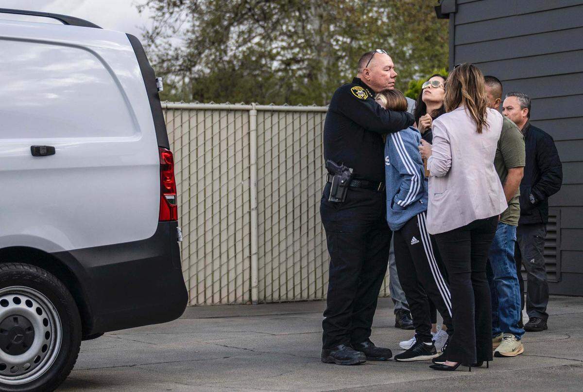 Marysville Police Chief Christian Sachs consoles family members of fallen officer Osmar Rodarte on Thursday, March 27, 2025, at the Lakeside Colonial Chapel before a procession through downtown Marysville to Placer County. Sachs announced in his retirement weeks after the officer’s shooting death.